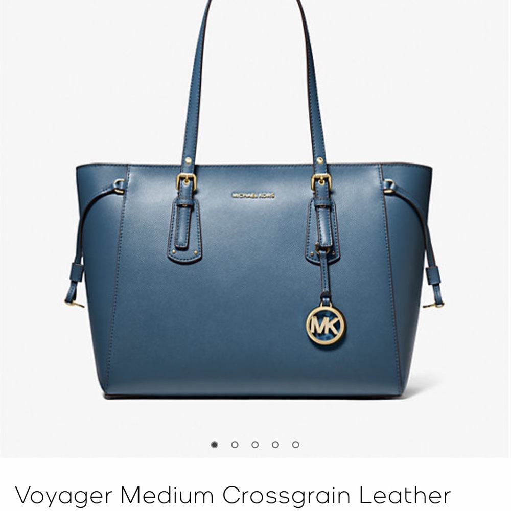 Navy blue collection Micheal Kors shoulder bag with gold trim.